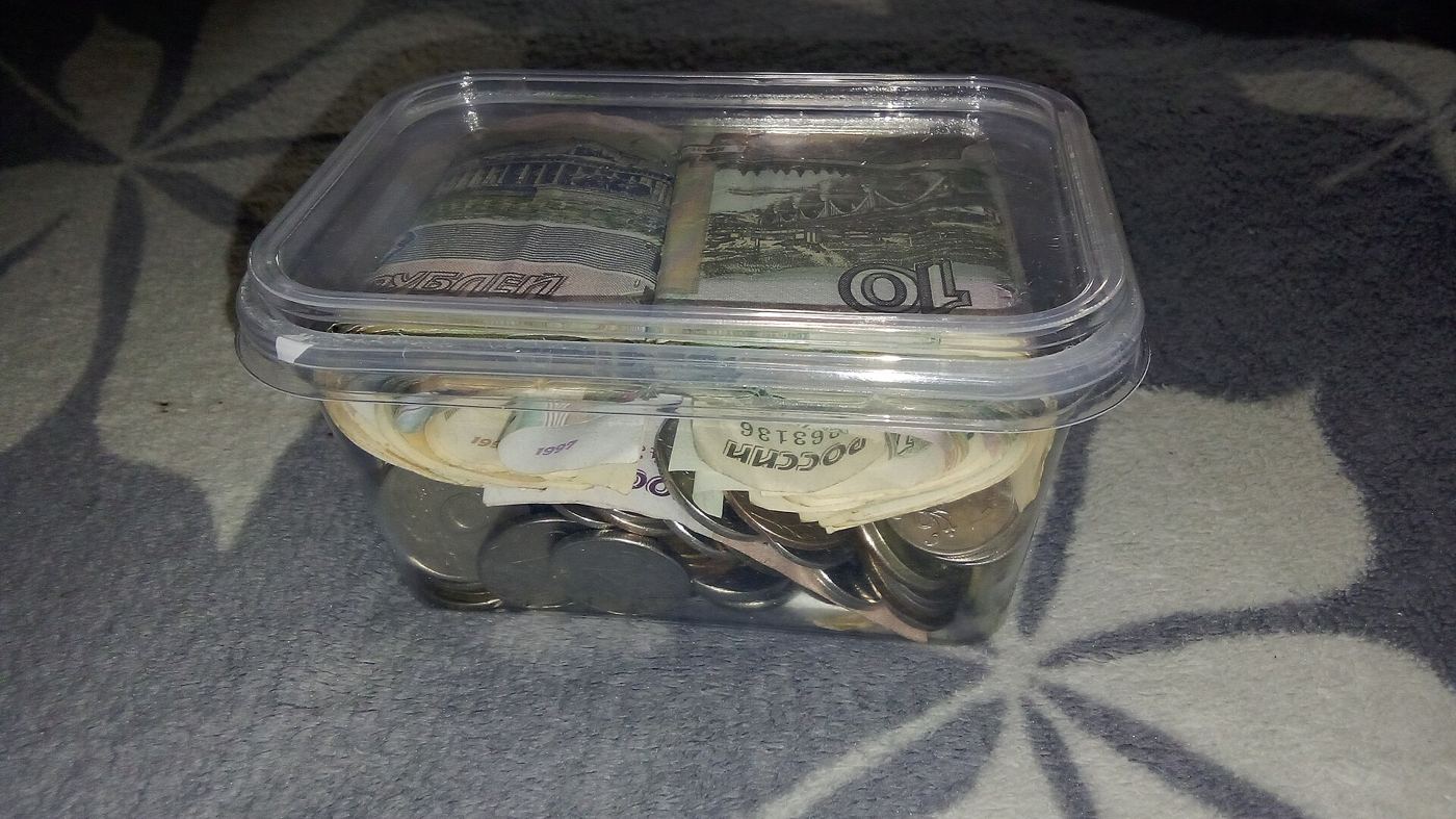 piggy bank surrounded by coins