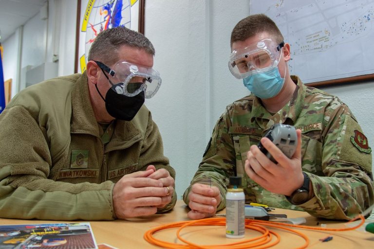 technician splicing fibre optic cables